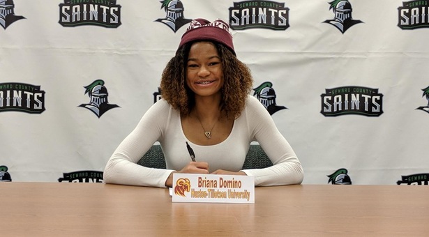 Domino Signs with Huston-Tillotson